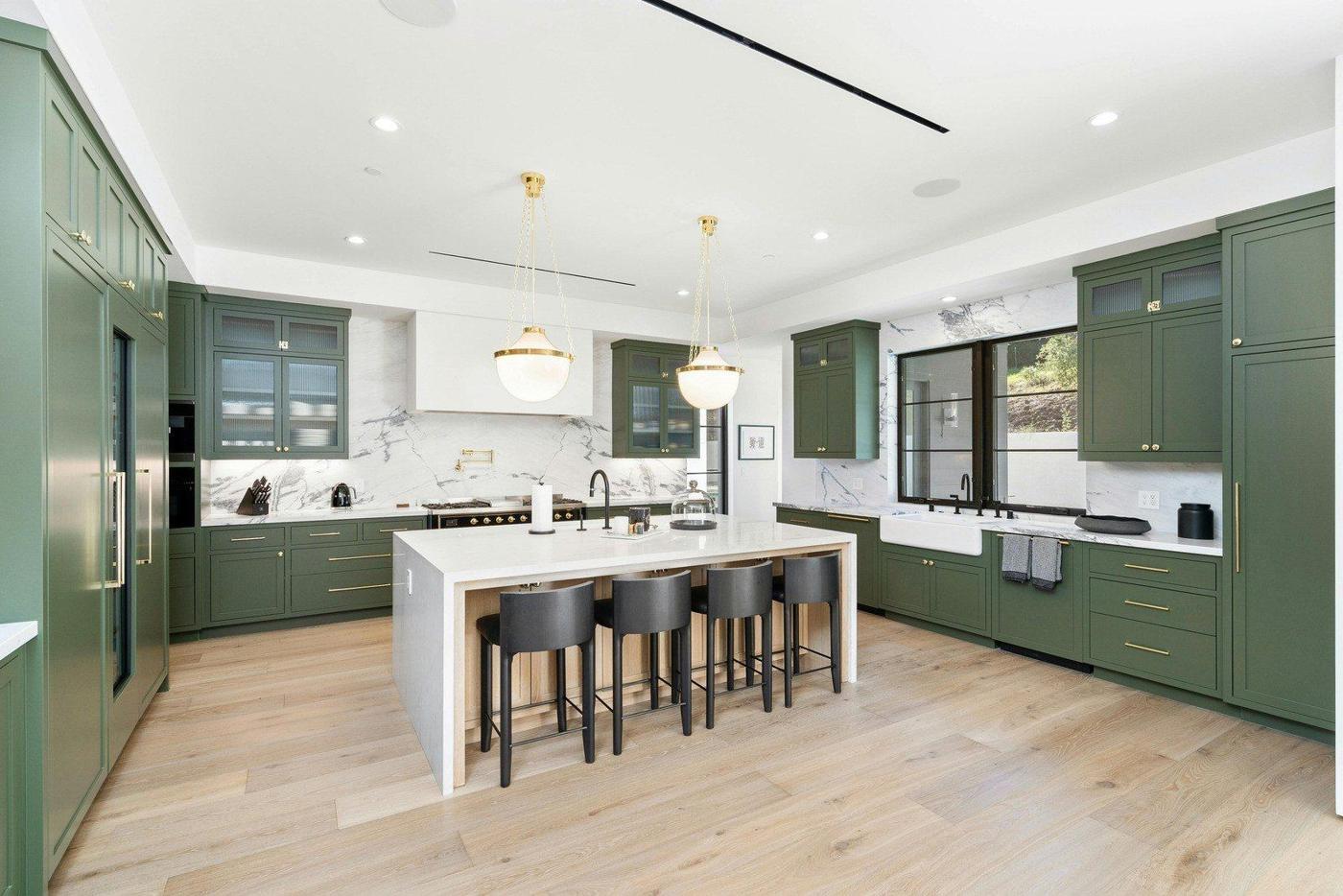 Green cabinets, quartz island